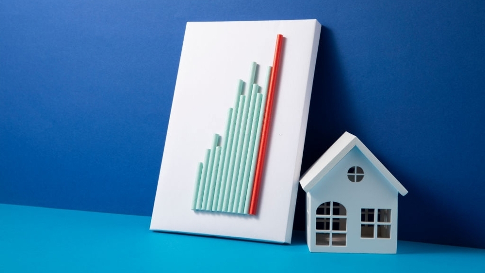 Mortgage concept with home and bar graph