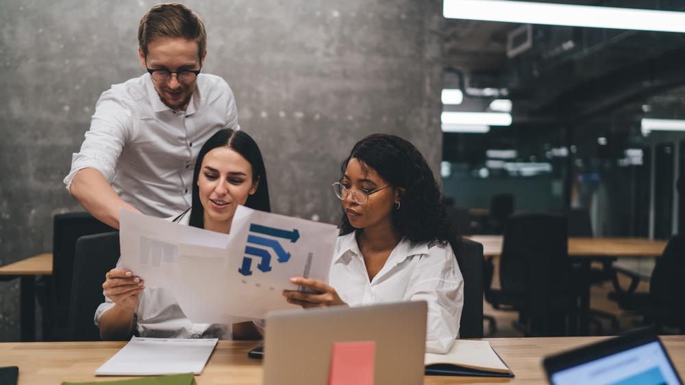 Diverse colleagues working on a project in an office